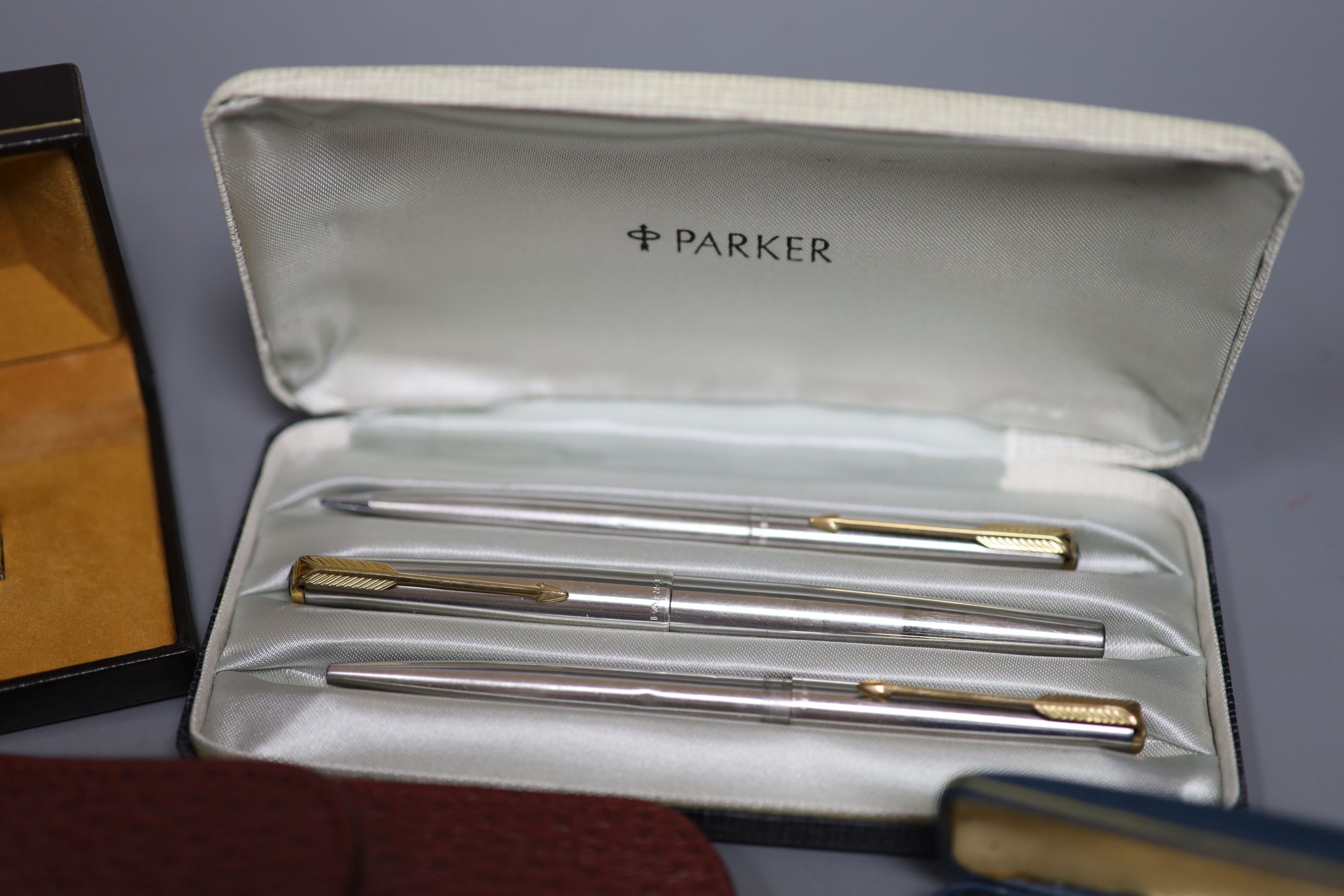 A Parker pen trio, boxed Parker fountain pen, other pens and pencils